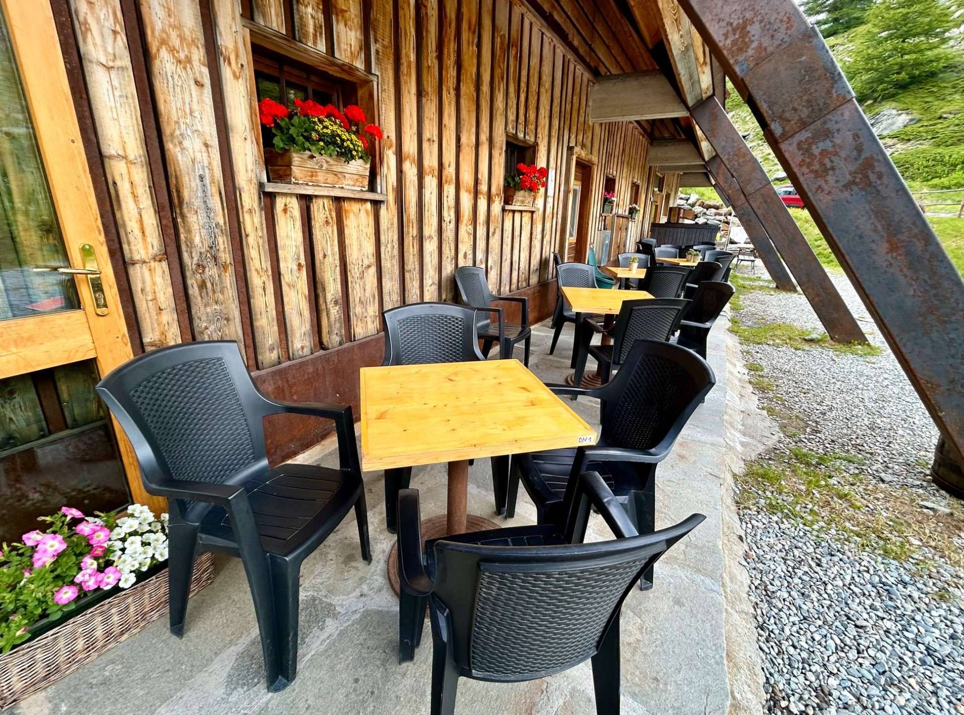 Covered outdoor seating at Cabane du Combal.