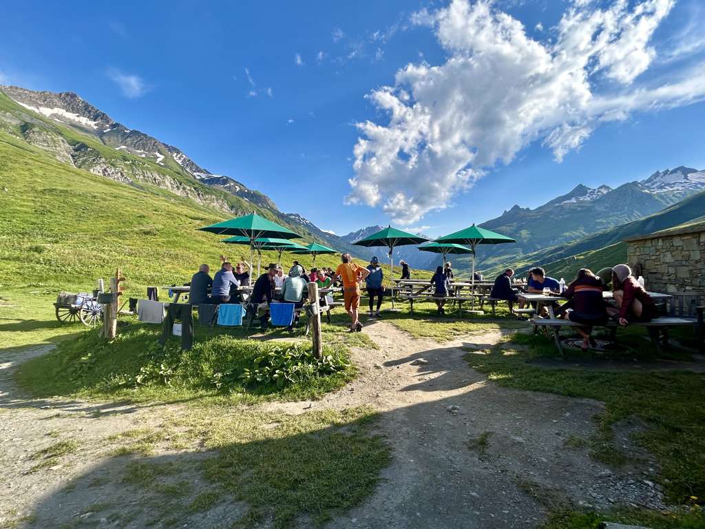 Hikers sitting outside refuge des mottets