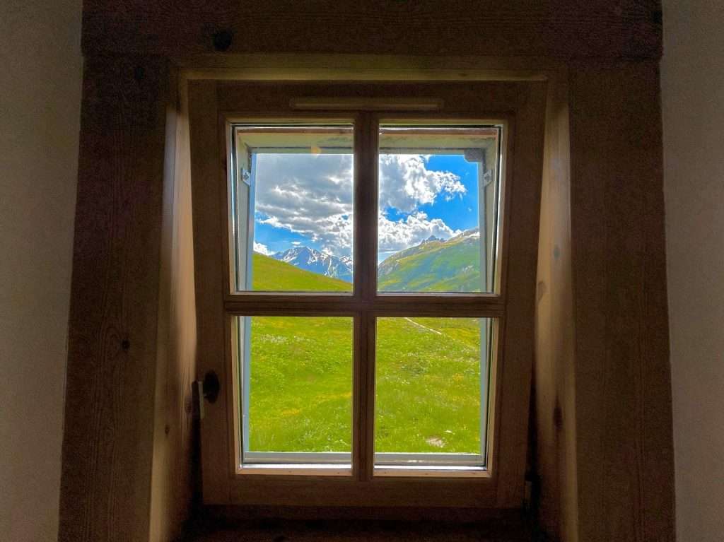 A view of mountains from a room at refuge des mottets