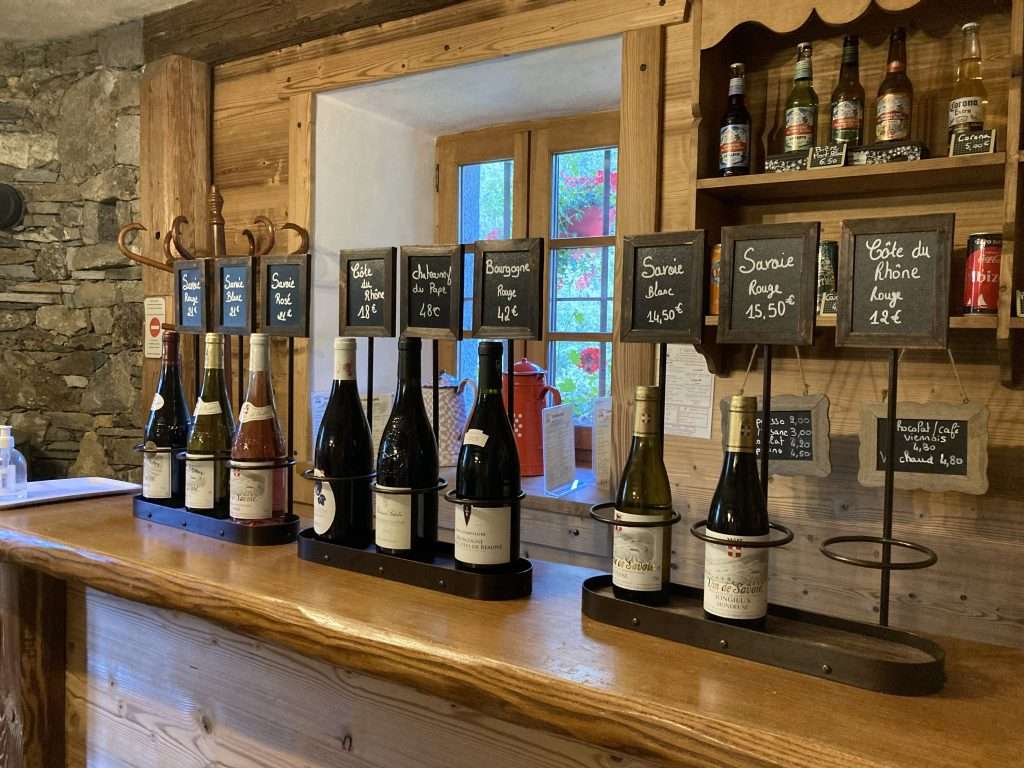 drink options displayed at the bar at refuge de nant borrant