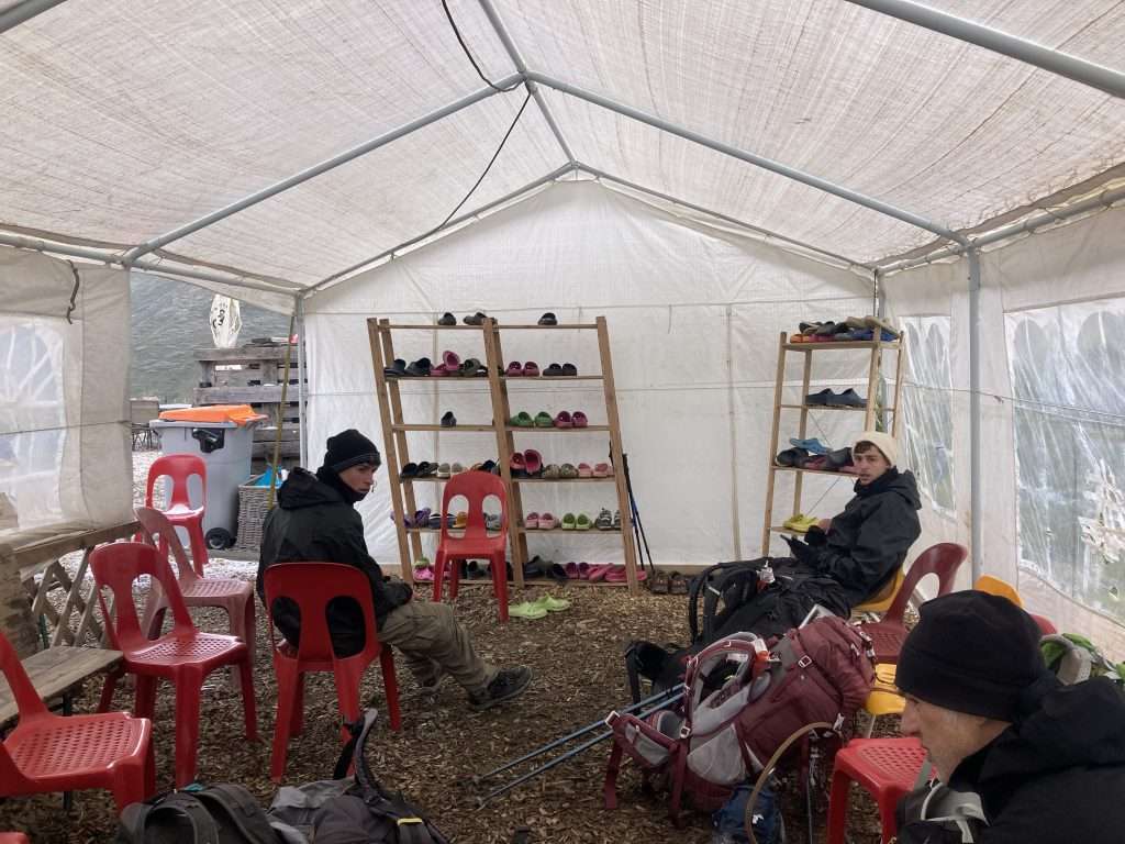hikers come in from the snow at alpage de la peule