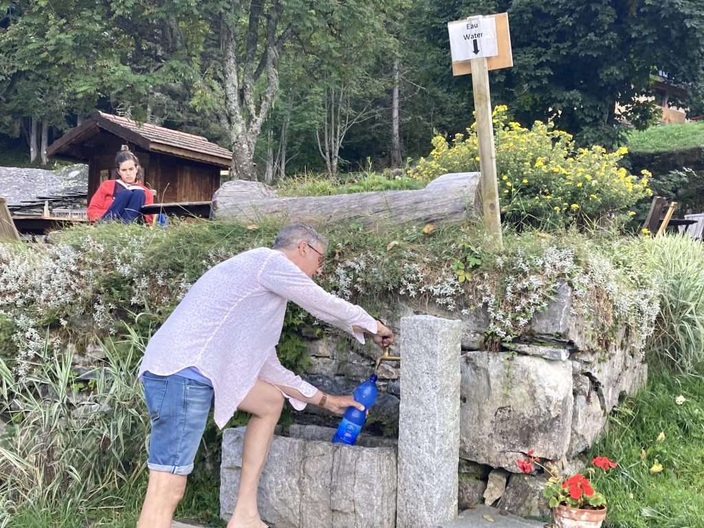 A typical water fountain on the tour du mont blanc outside of refuge de nant borrant