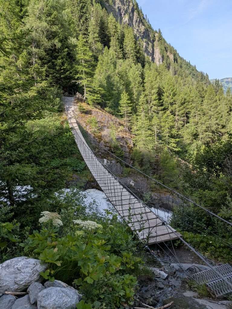 The suspension bridge spanning the Bionnassay torrent.