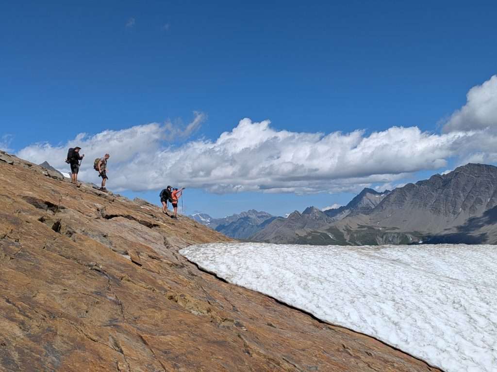 Hikers enjoying a view at the col des fours.