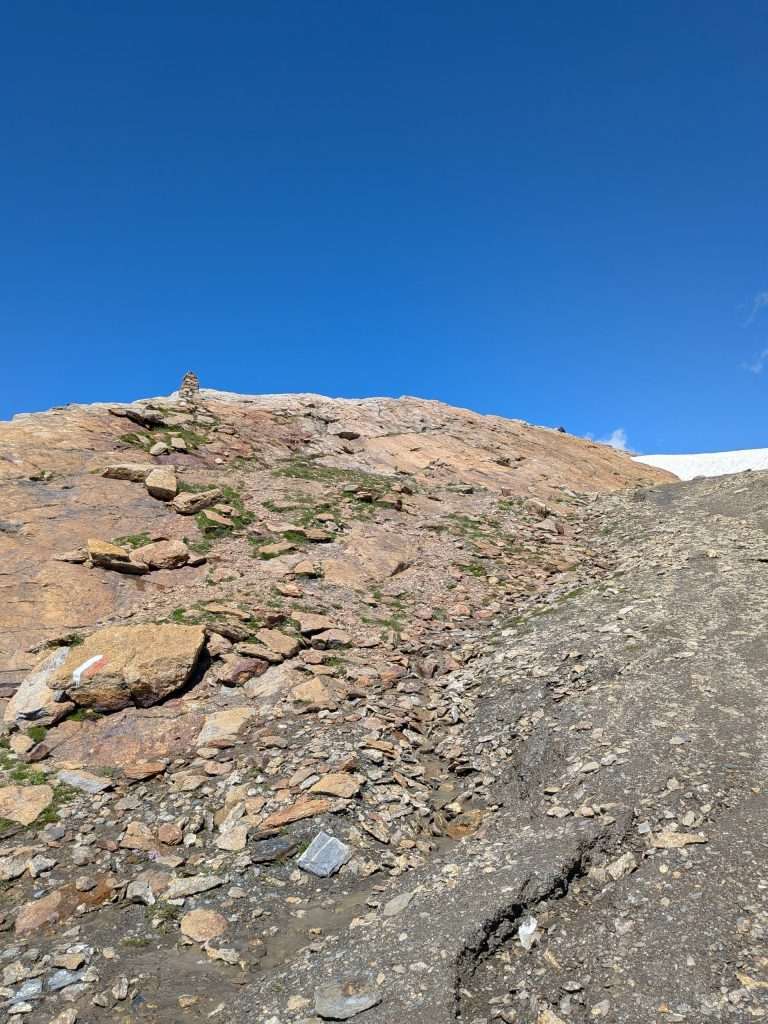 A rocky trail leads to col des fours.